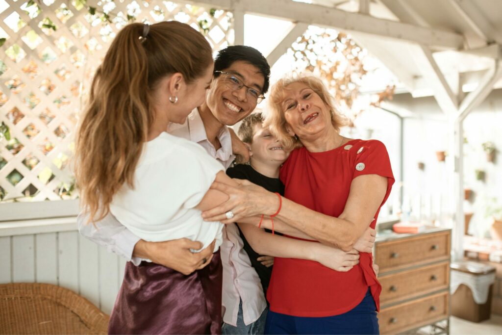 A family hugging themselves