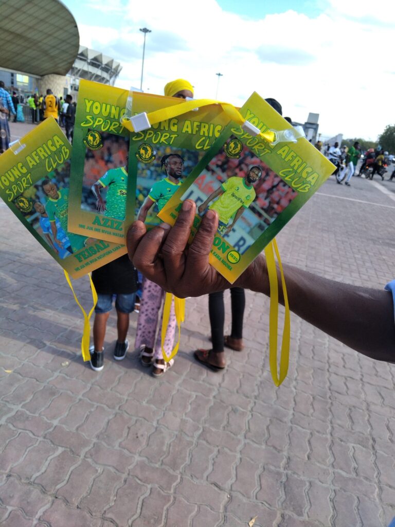 Close-up of commemorative Young Africans SC merchandise bags held at Benjamin Mkapa Stadium in Dar es Salaam, Tanzania