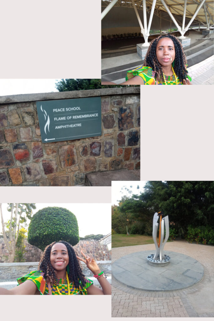 A commemorative plaque at the Kigali Genocide Memorial marking the Peace Theatre amphitheater, surrounded by landscaped gardens.